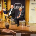 image of Berkeley Law Dean Erwin Chemerinsky and the National Review's David French share a stage, engaged in a civil discussion on politics
