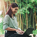 young woman studyin outside